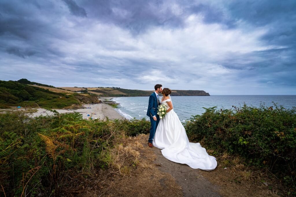 bride and groom on the beach in cornwall