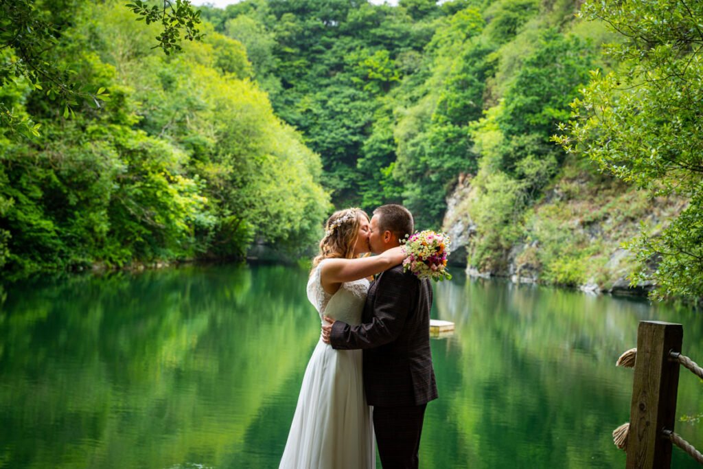 bride and groom kissing at cornish tipis in cornwall