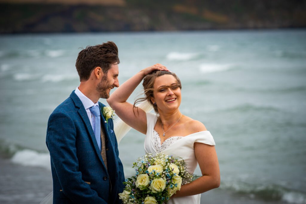 bride and groom on the beach in cornwall close up