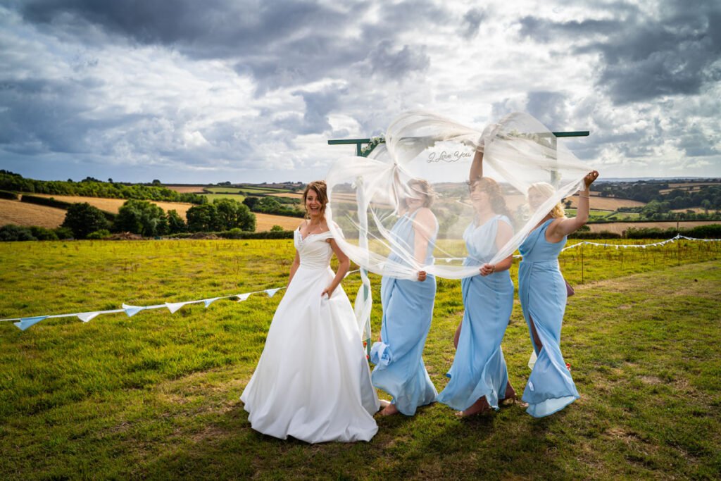 bride, bridesmaids with the veil funshot