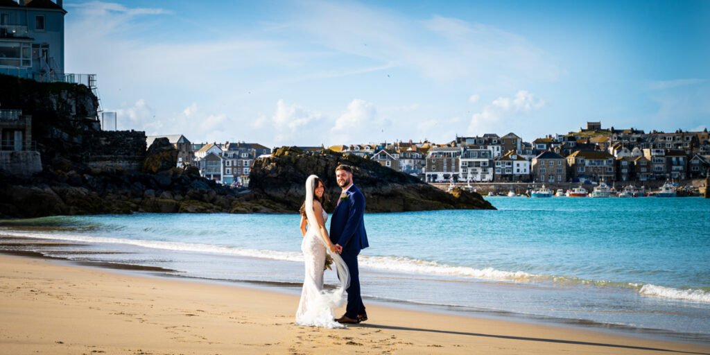 bride and groom on Porthminister beach St Ives