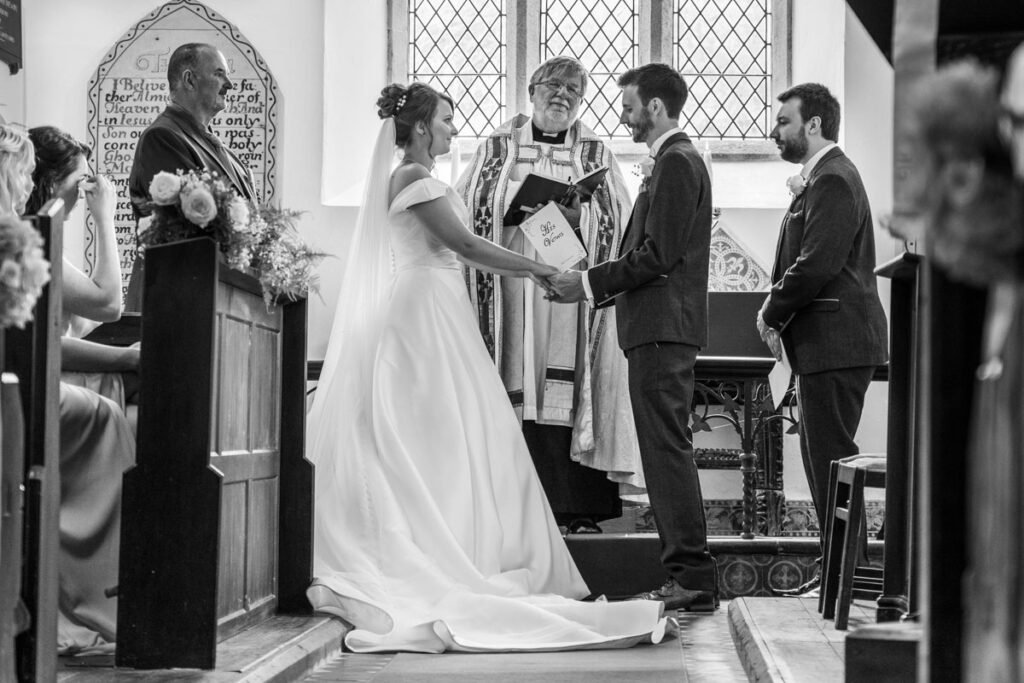 bride and groom church wedding ceremony in cornwall B&W