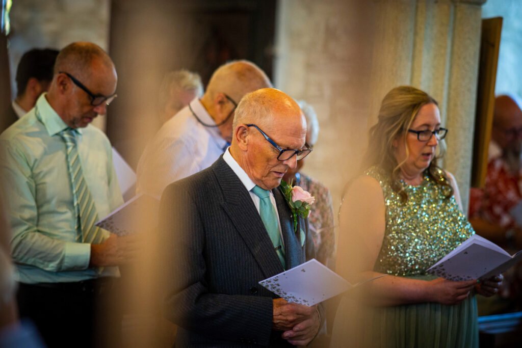 guests singing during the wedding ceremony