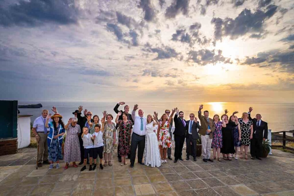 wedding group shot at The Polurrian hotel in cornwall at sunset