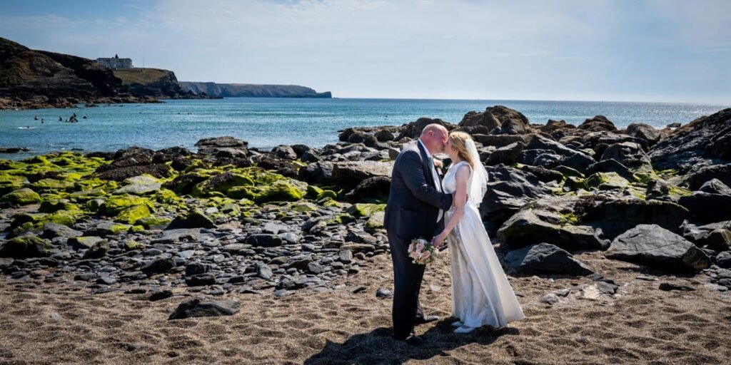 Bride and groom on the beach cornwall