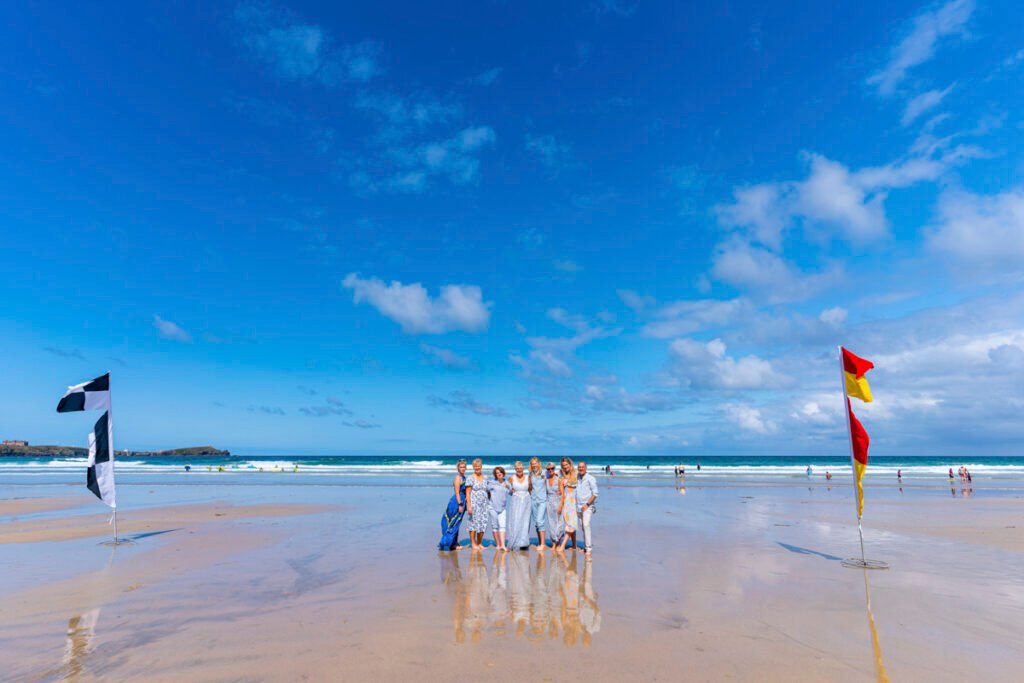 newquay same sex wedding group shot on the beach