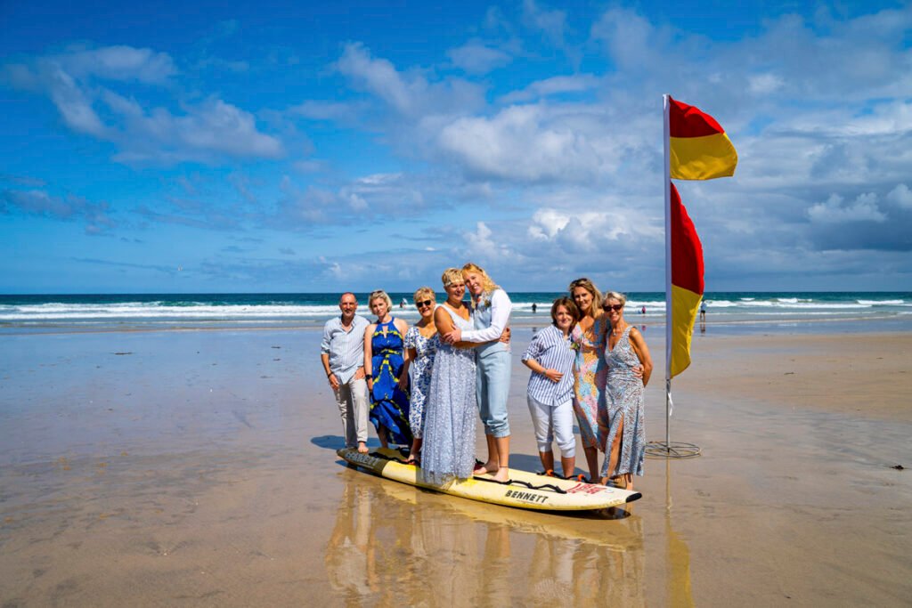 newquay same sex wedding group shot on the beach