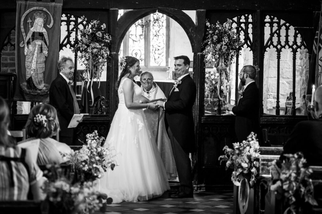 Bride and groom at the church wedding ceremony B&W