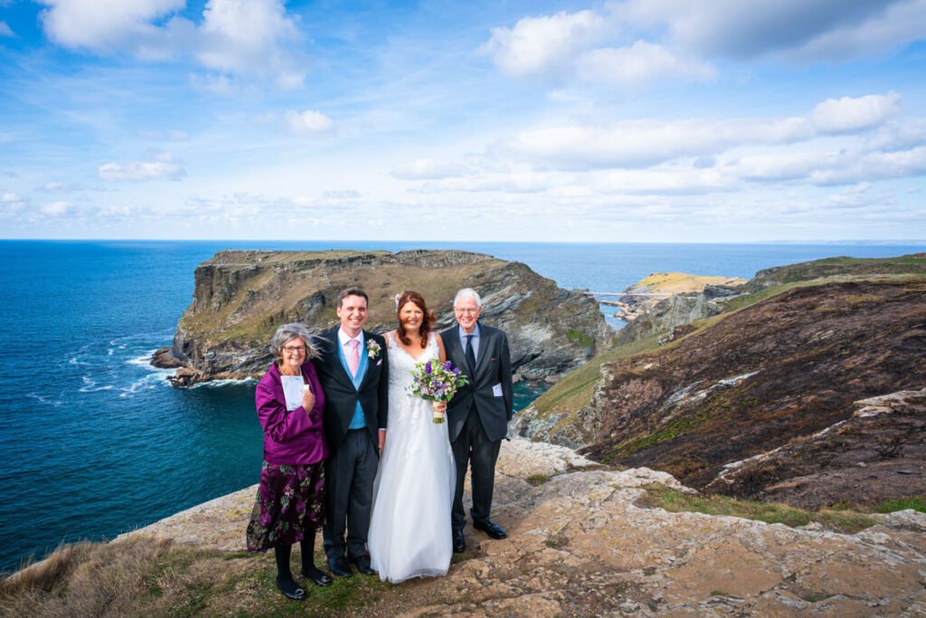 wedding group shot on the cliff overlooking tintagel island