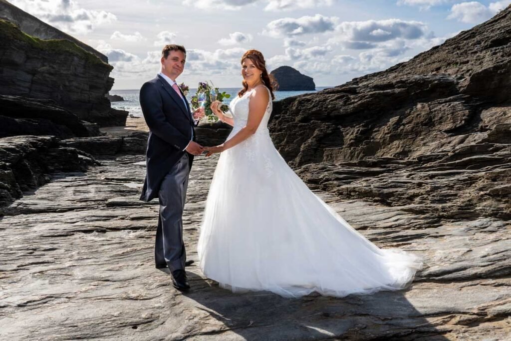 Bride and groom at Trebarwith starnd beach in cornwall