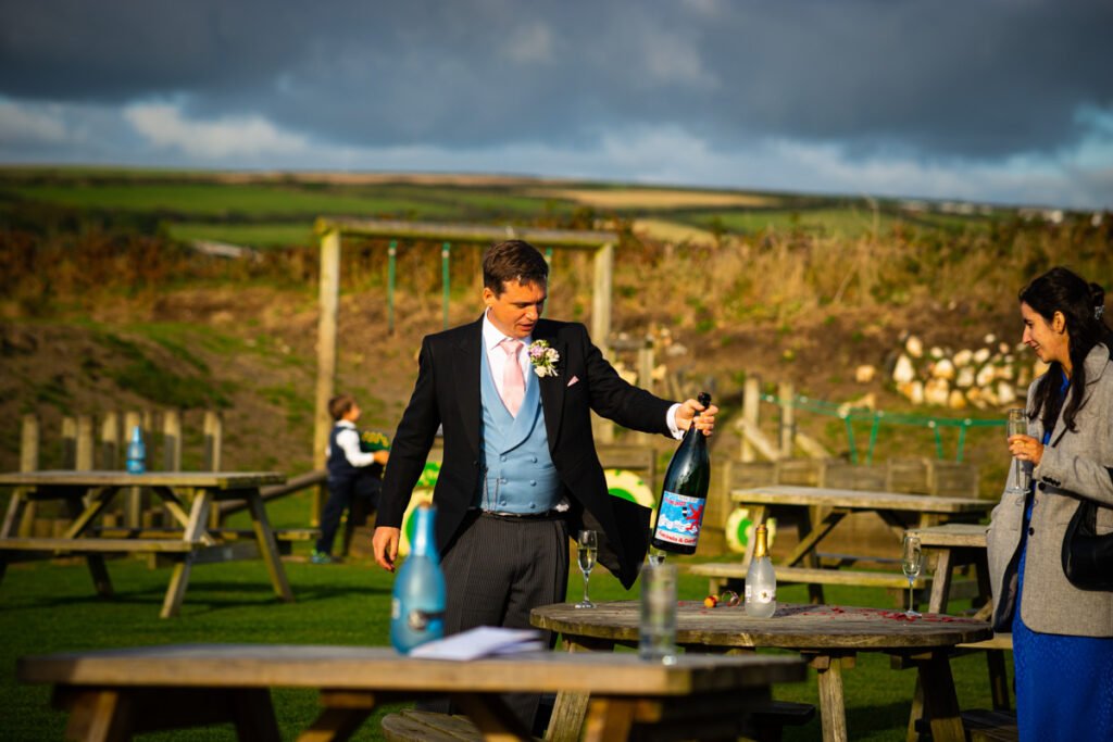 groom with magnum bottle of fizz