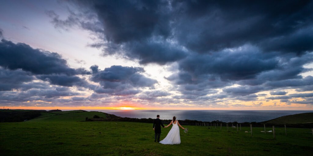 bride and groom sunset wedding image by the sea