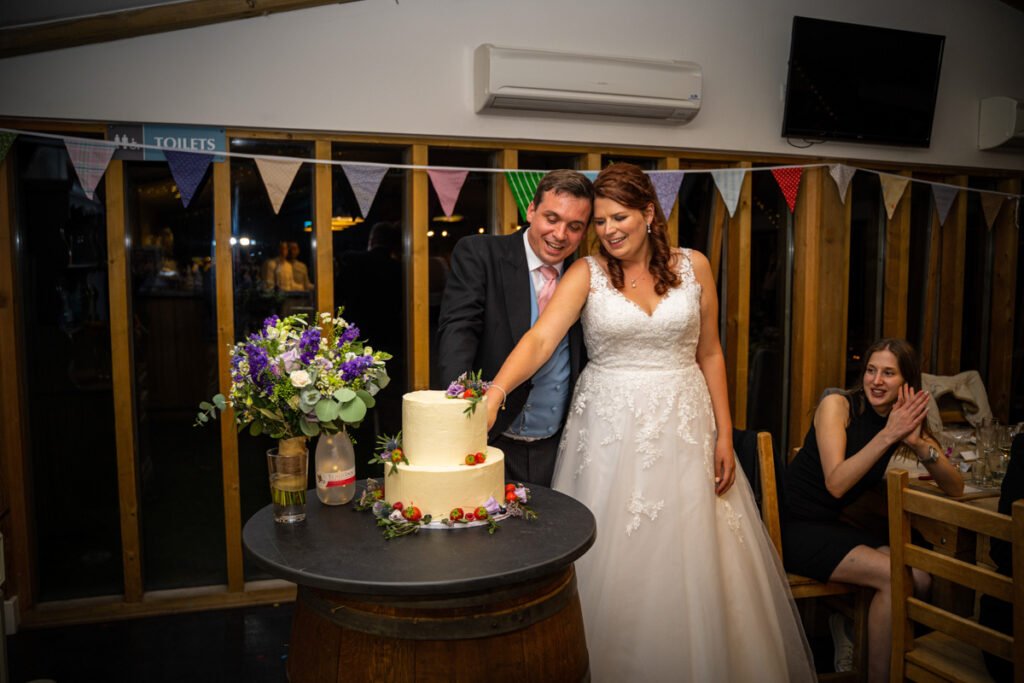 bride and groom cake cutting