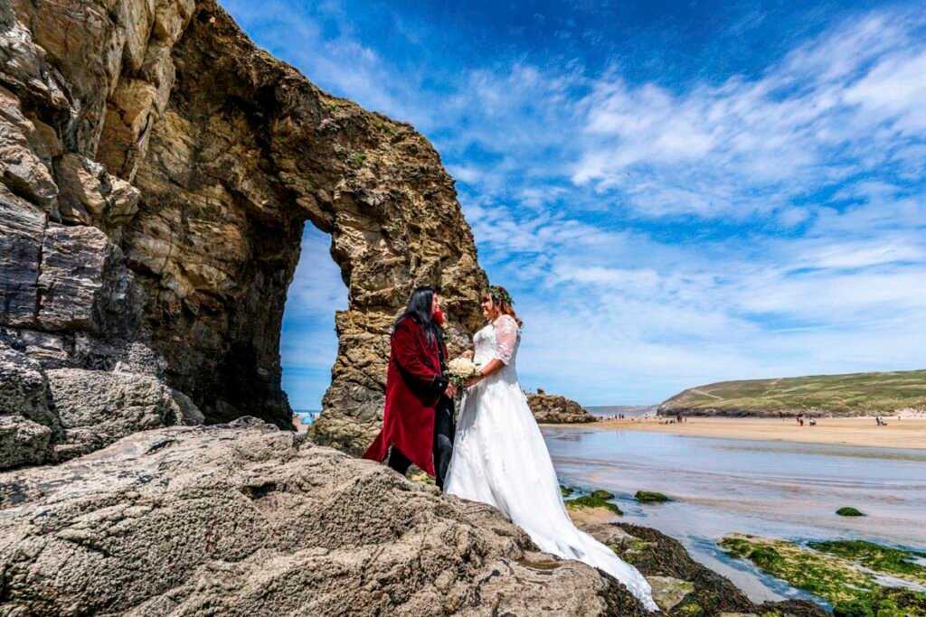 bride and groom on perranporth beach cornwall