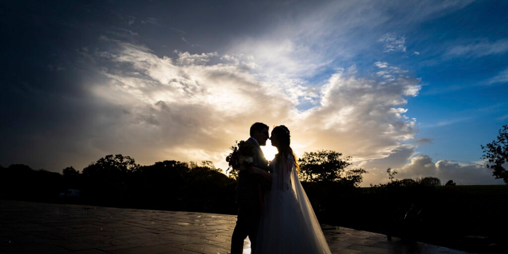 bride and groom silhouette photo sunset