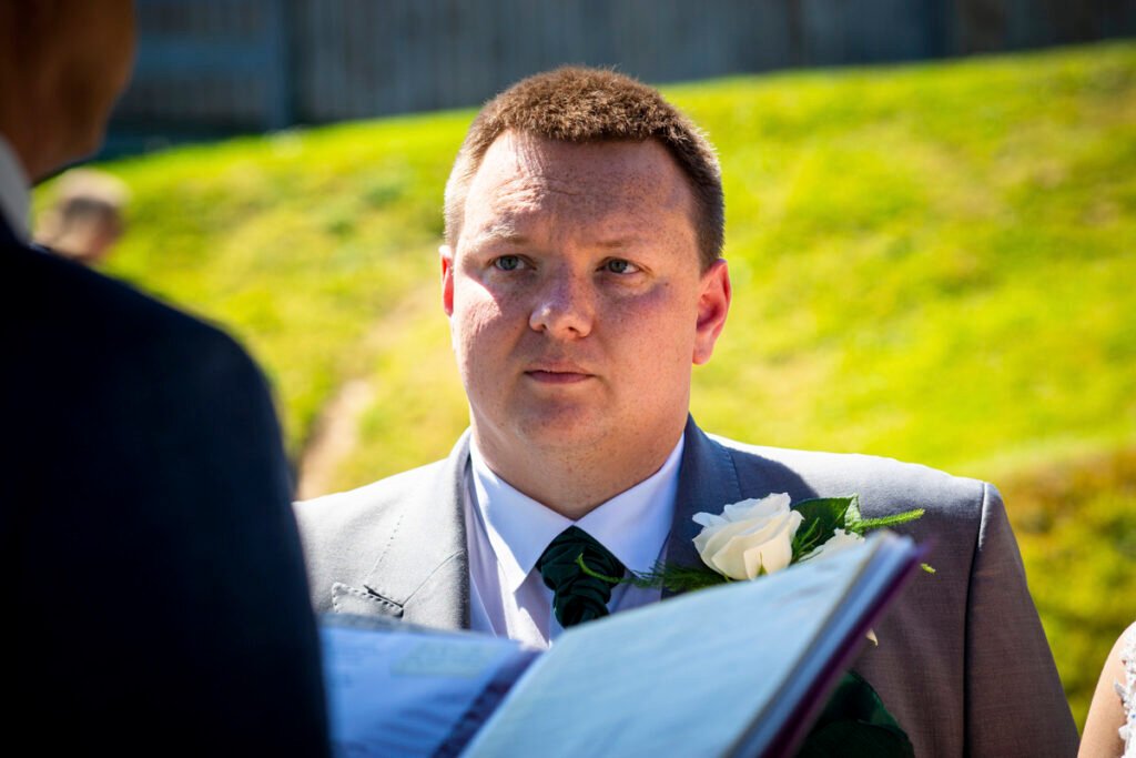 Groom portrait during the ceremony at the Sandy Cove Hotel Devon