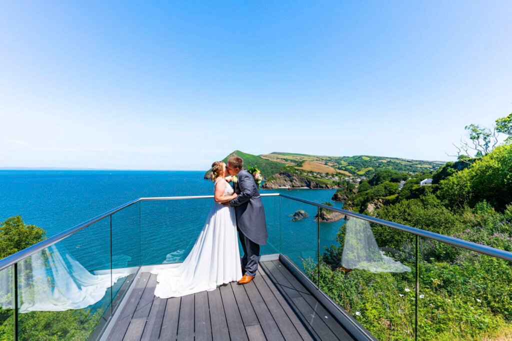 Bride and Groom portrait overlooking the sea at the Sandy Cove Hotel Devon
