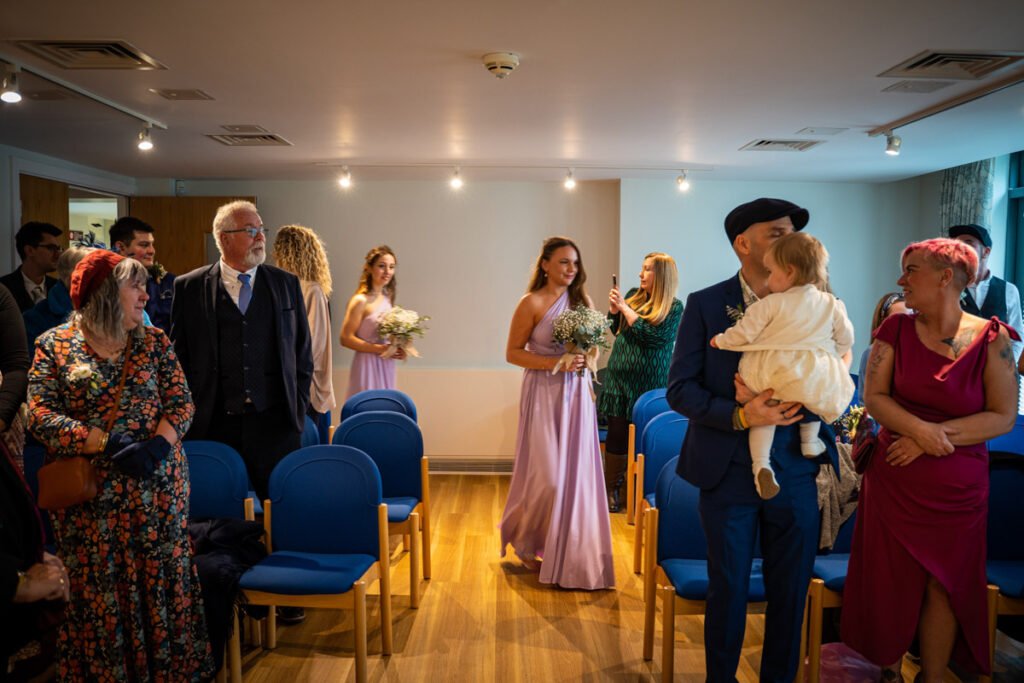 Bridesmaids coming down the aisle wedding photograph in cornwall