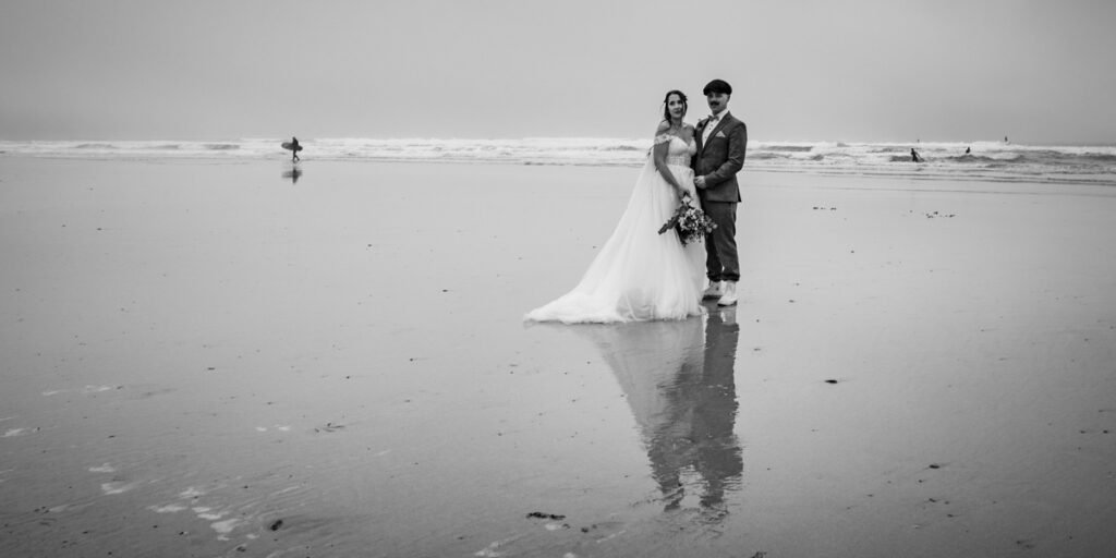 Bride and groom at Godrevy beach cornwall B&W