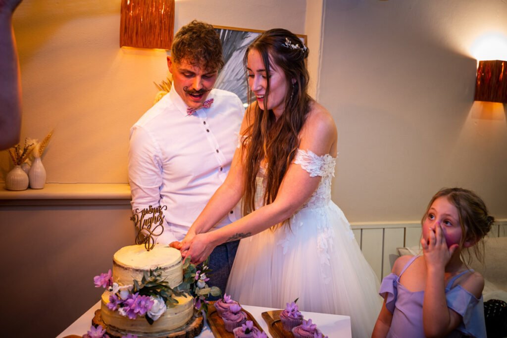 wedding cake cutting photograph