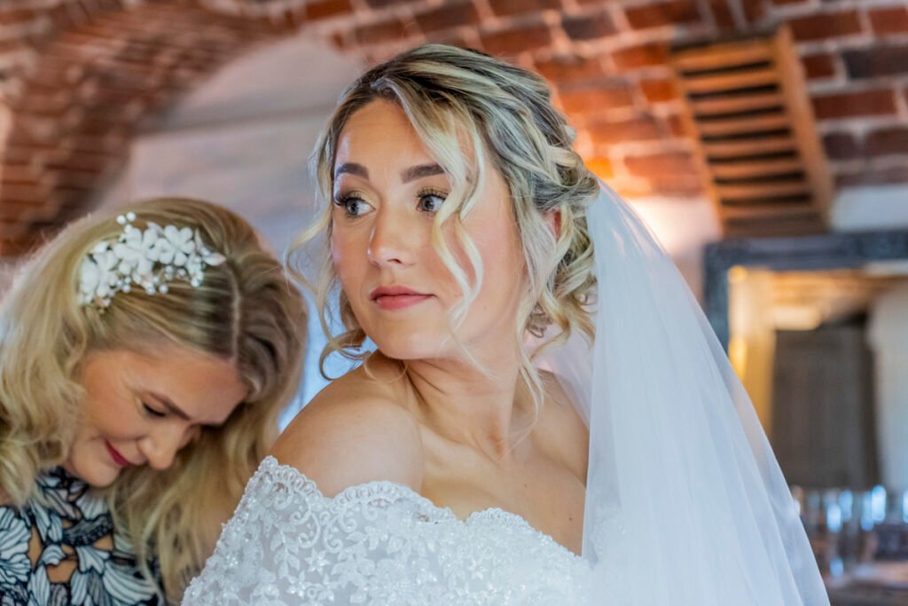 bride with her mother getting ready