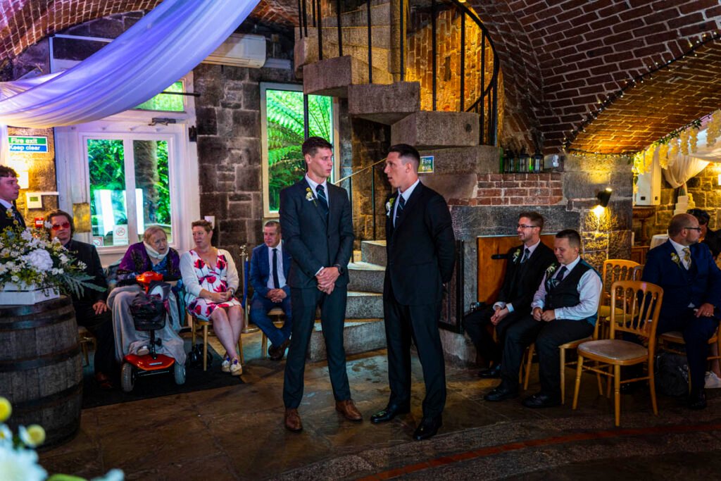 groom and best man waiting for the wedding ceremony at Polhawn Fort cornwall wedding venue