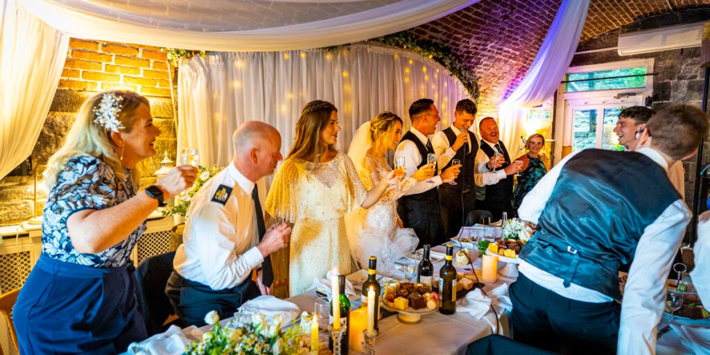 wedding speeches toast top table at Polhawn Fort cornwall wedding venue