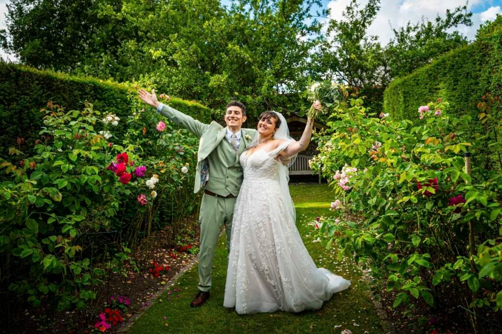 bride and groom celebrating in the garden