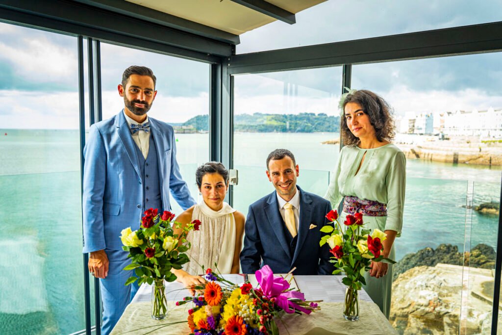 Bride and groom and witnesses signing the register