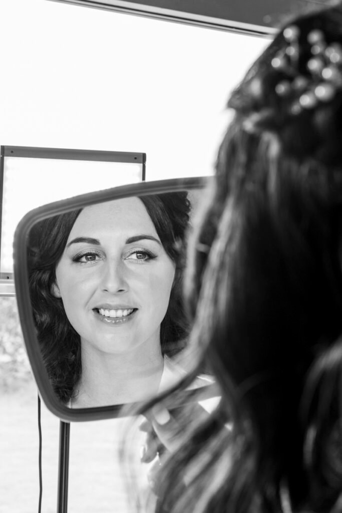 bride getting ready image in the mirror