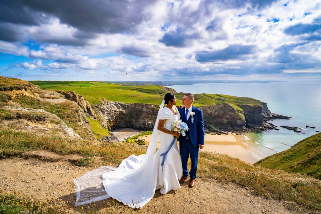 bride and groom on the coast path