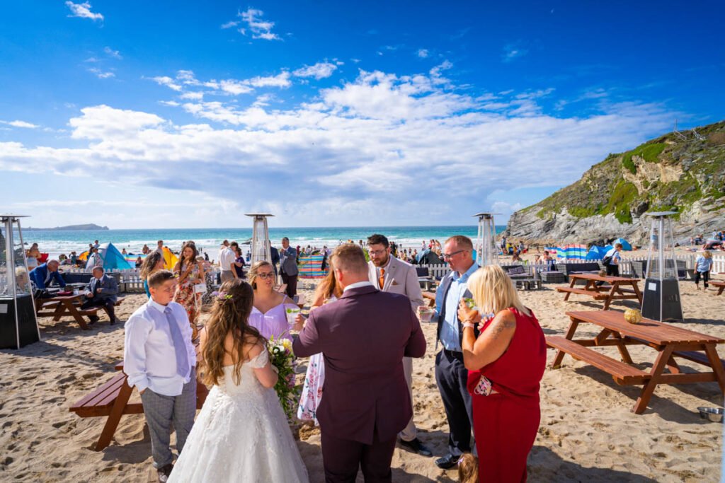 wedding guests on the beach