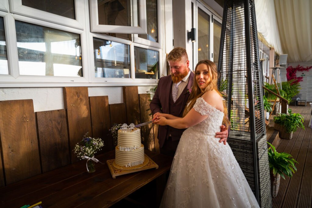 Brid and groom cutting the cake