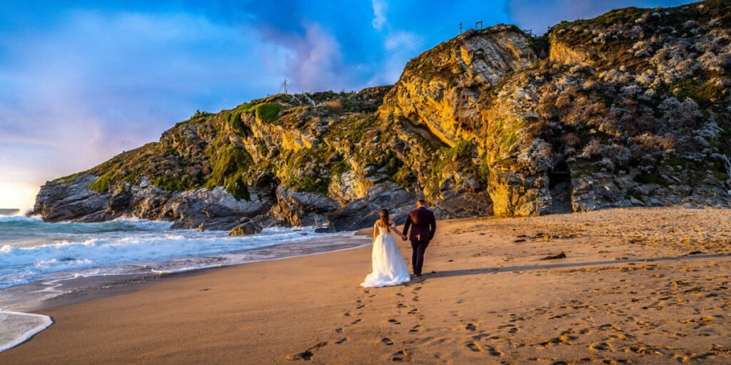 Bride and Groom walking away on the beach