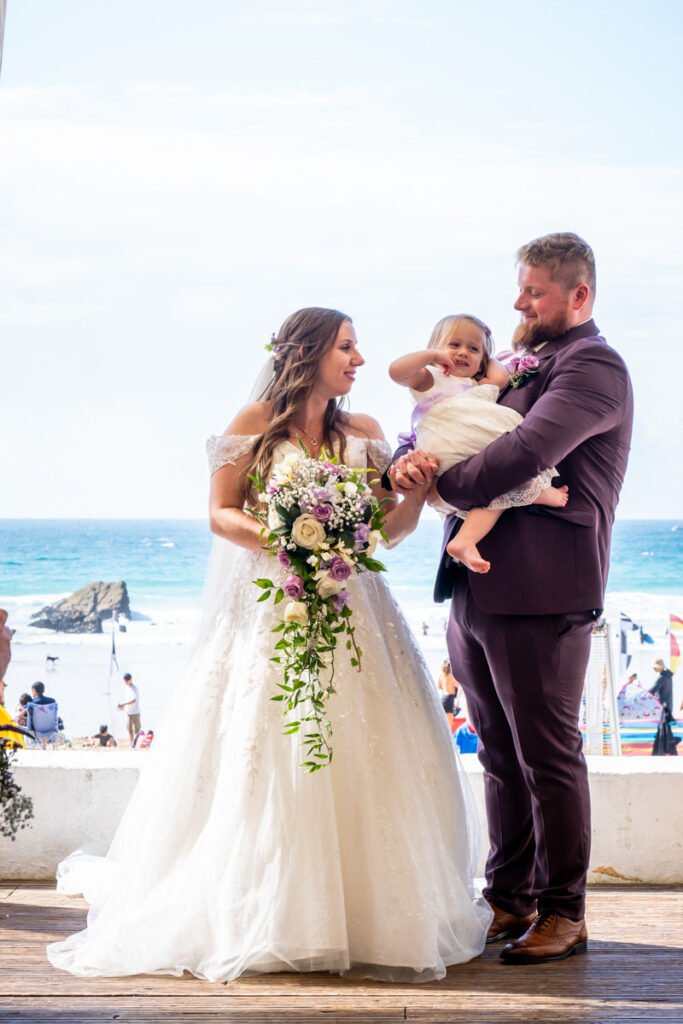 bride, groom and daughter