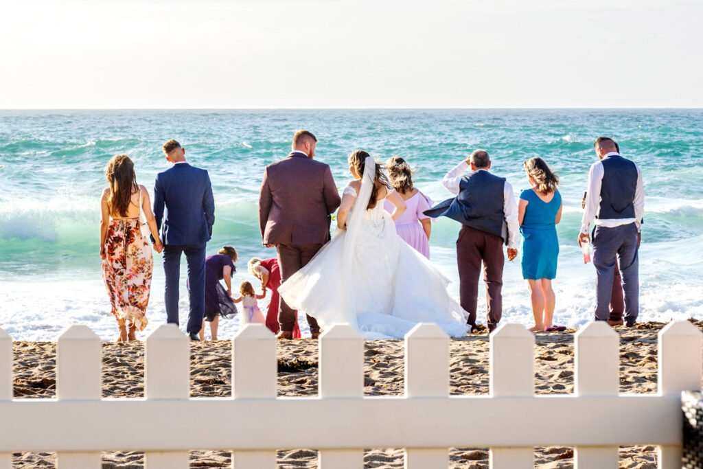 wedding guests on the beach