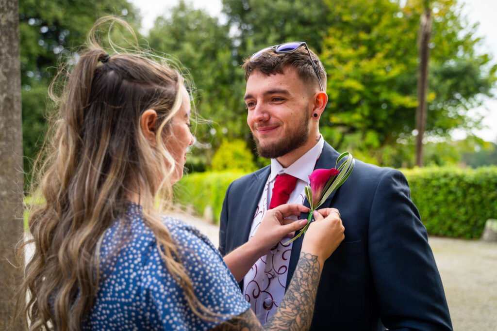 Best man buttonhole attaching