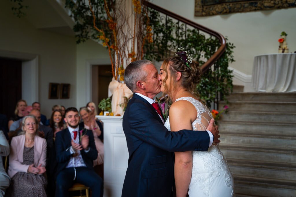 Bride and Groom during the wedding ceremony 1st kiss