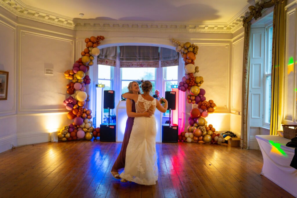 Bride and Bridesmaid Dancing