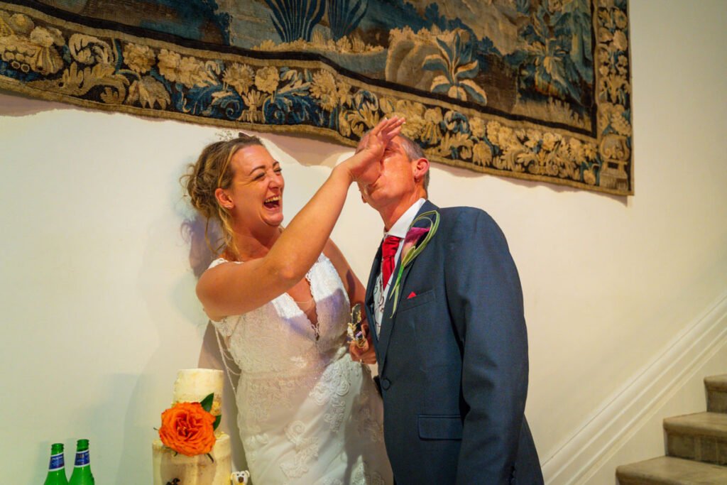 Bride and Groom cutting the wedding cake