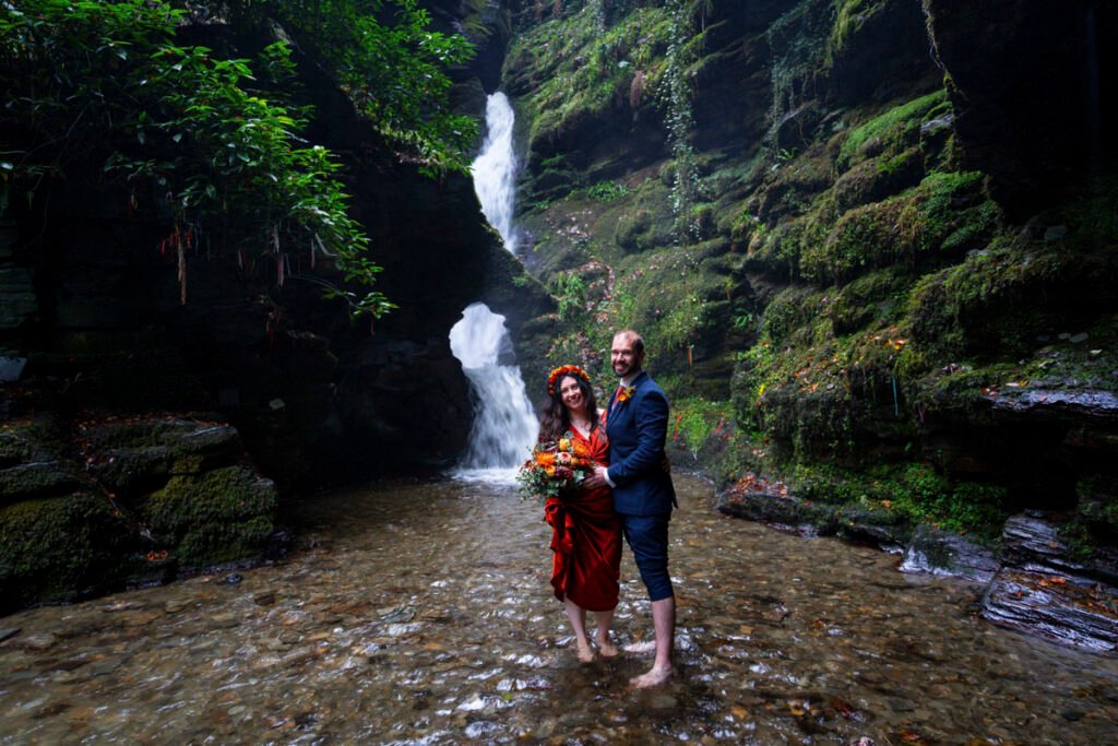 Bride and Groom by a waterfall