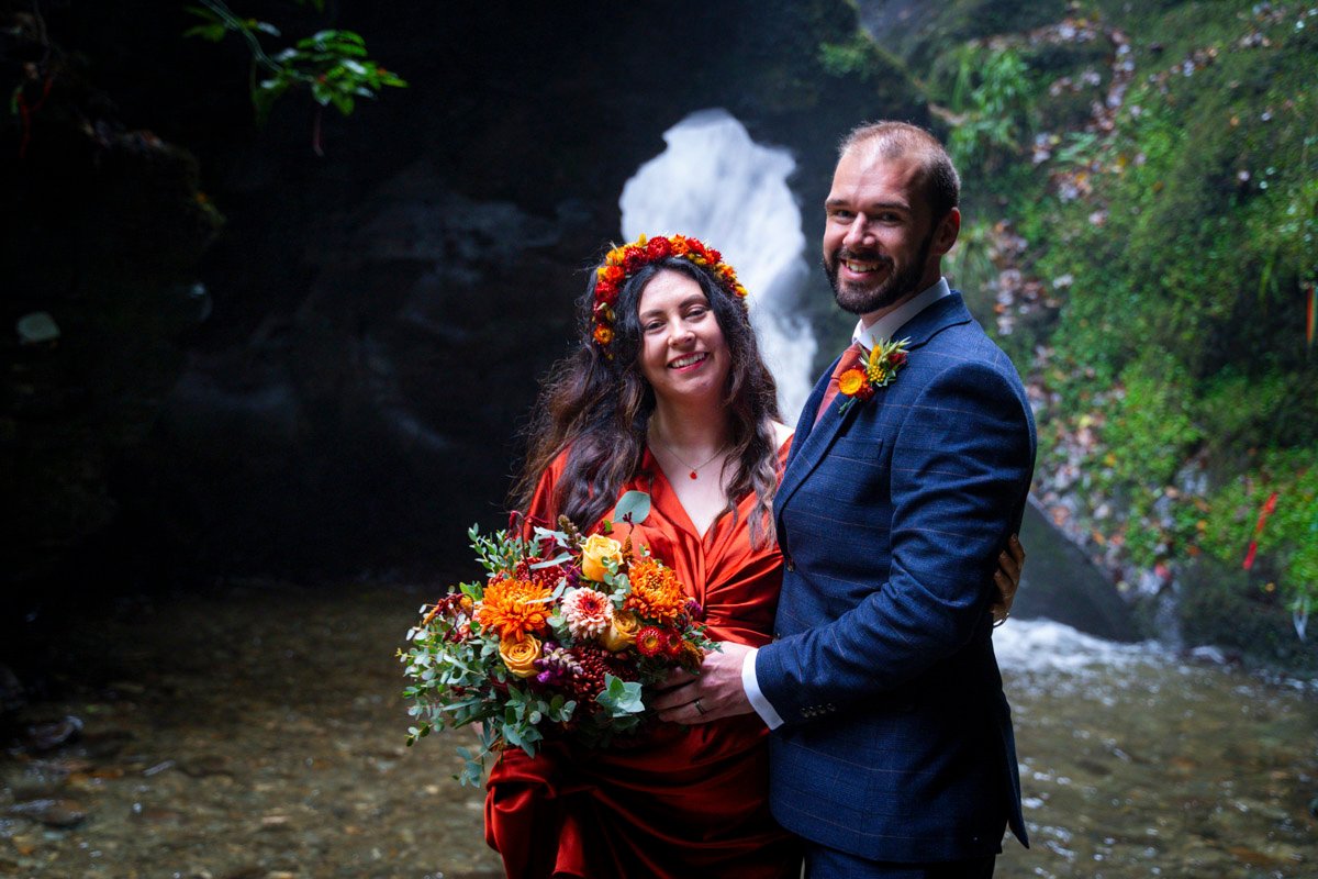 Bride and Groom by a waterfall