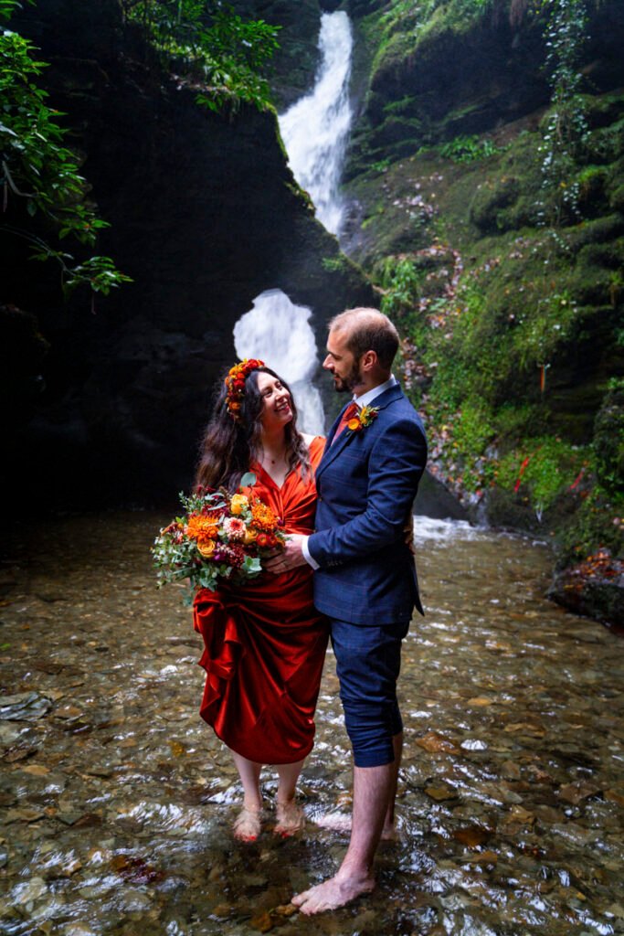 Bride and Groom by a waterfall