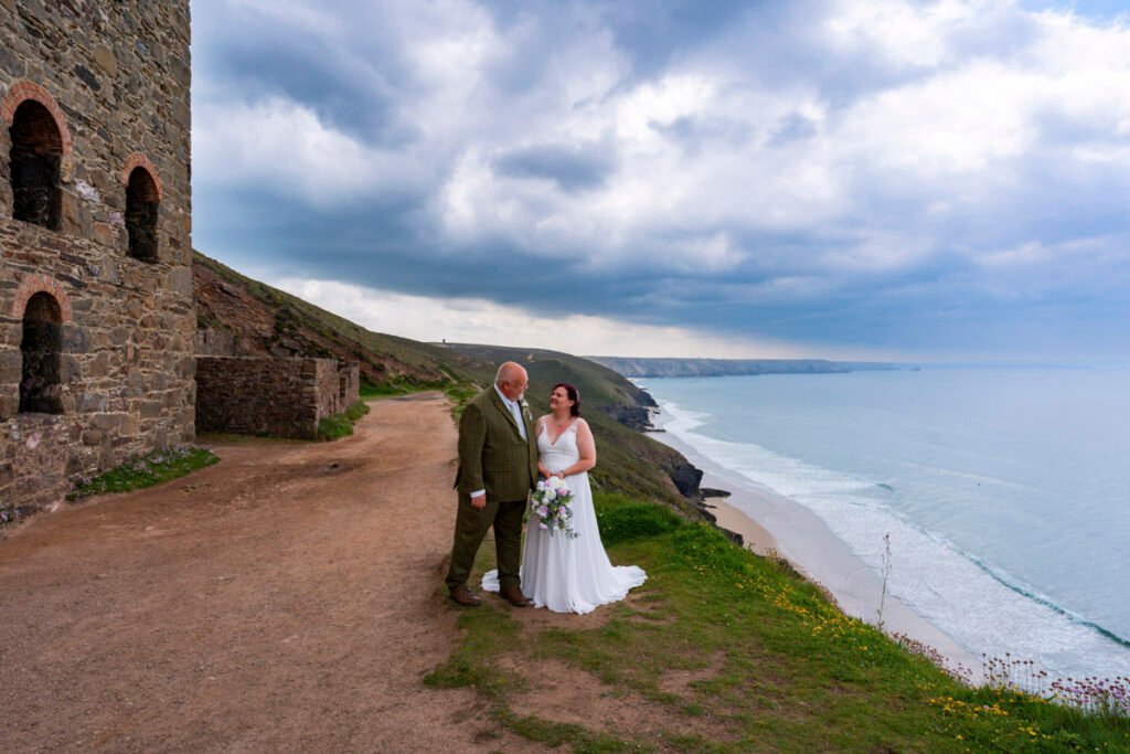 Bride and Groom on the coastpath by Wheal Coates mine engine house