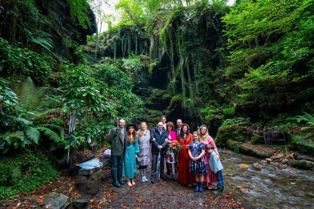 wedding party by a waterfall