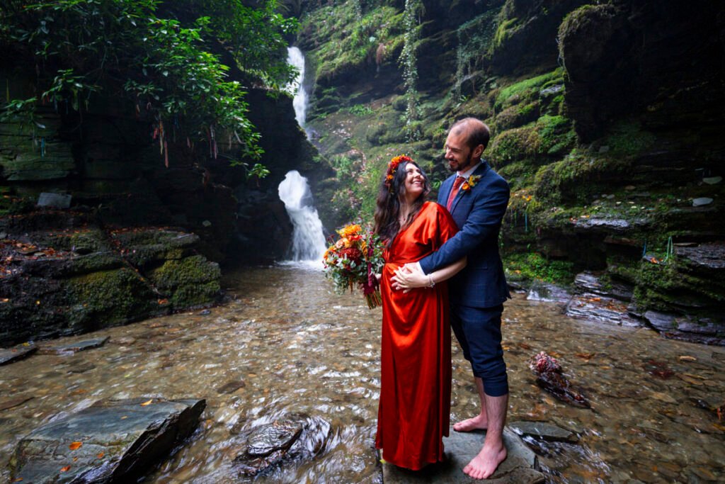 Bride and Groom by a waterfall
