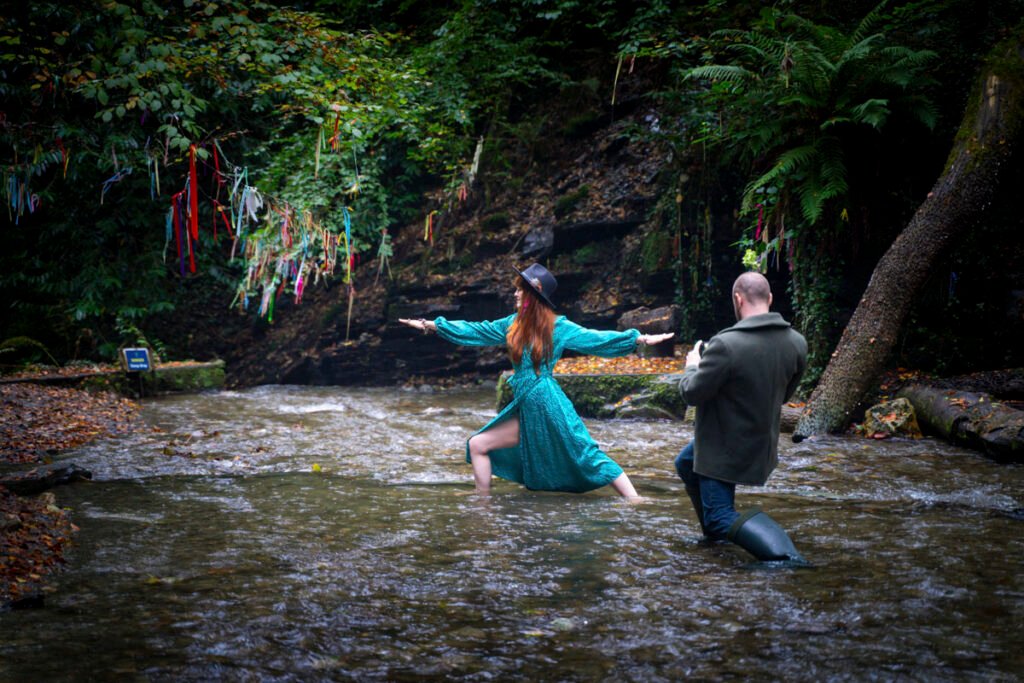 wedding guests in a stream posing