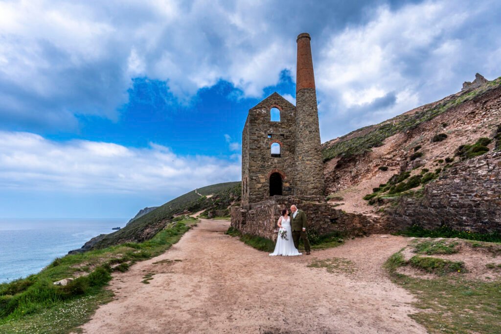 Bride and Groom on the coastpath by Wheal Coates mine engine house