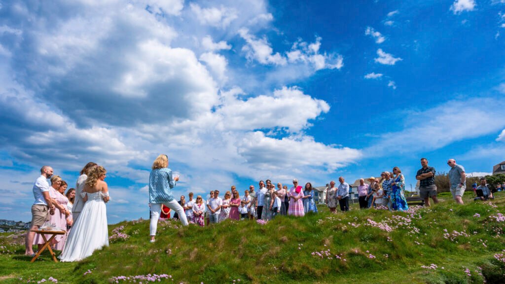 the wedding ceremony on the cliff top overlooking the beach
