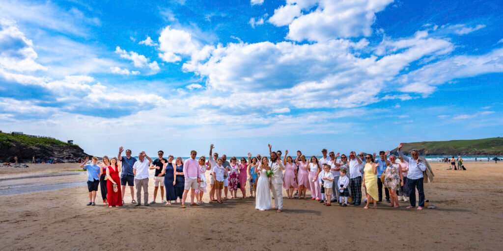 Wedding guests group shot on the beach